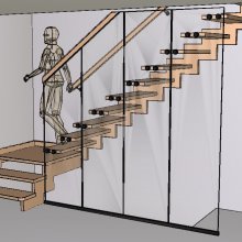 Moderné, dizajnové schodisko so stupňami kotvenými v skle, ktoré prechádza do zábradlia. Sklo zároveň slúži ako zábrana pre otvor pod schodiskom.